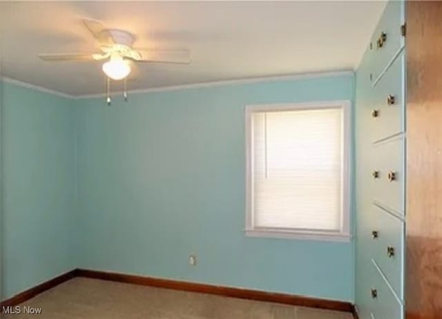 unfurnished room with crown molding and ceiling fan