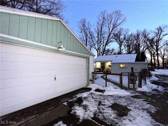 view of snow covered garage