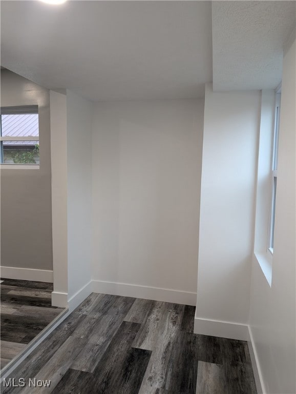 spare room with dark hardwood / wood-style flooring