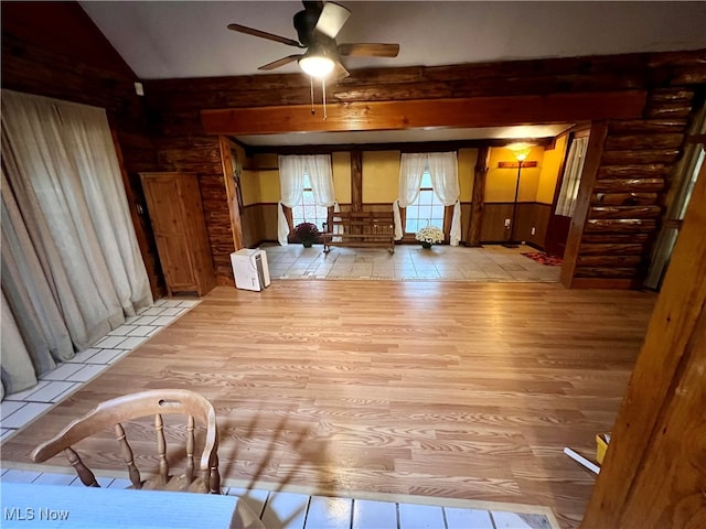 interior space with lofted ceiling, ceiling fan, and light hardwood / wood-style flooring