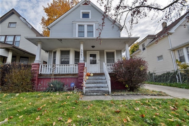 view of front of property with a front lawn and covered porch