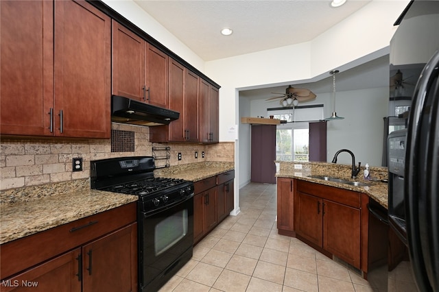 kitchen with black appliances, tasteful backsplash, light stone countertops, sink, and ceiling fan