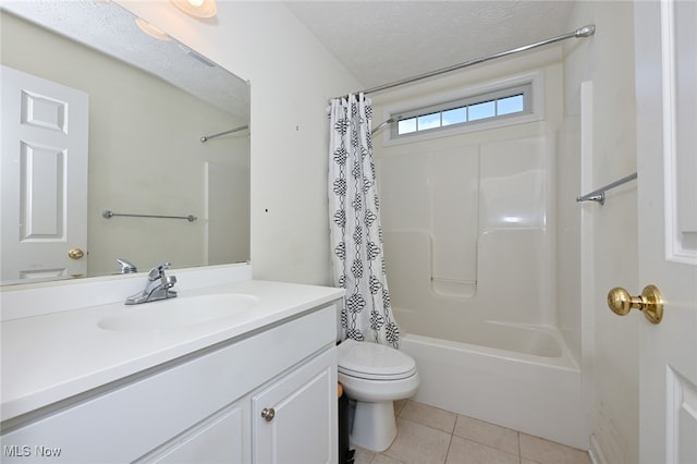 full bathroom featuring tile patterned floors, vanity, a textured ceiling, shower / bath combo, and toilet