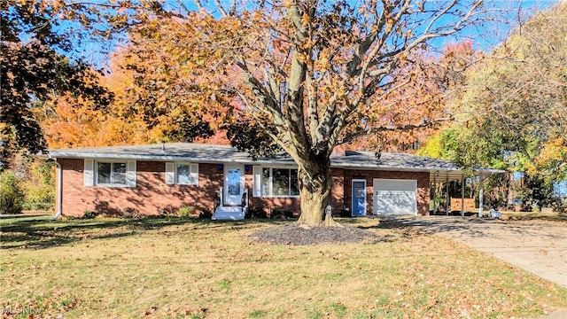 ranch-style home with a garage and a front yard