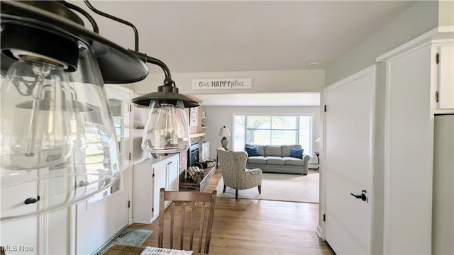 kitchen featuring white cabinets and light hardwood / wood-style floors