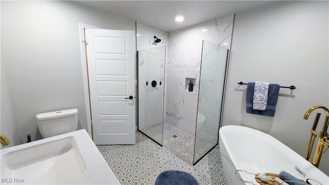 full bathroom with toilet, sink, and separate shower and tub