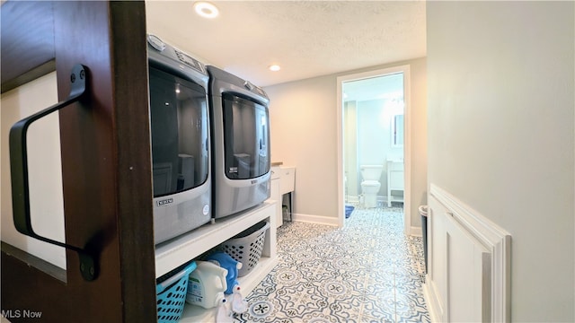 laundry room featuring a textured ceiling