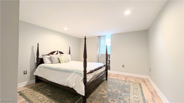 bedroom with hardwood / wood-style flooring