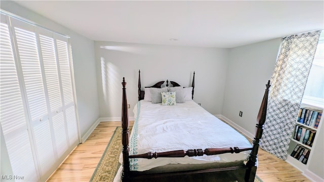 bedroom with light wood-type flooring