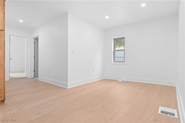 unfurnished room featuring light hardwood / wood-style floors