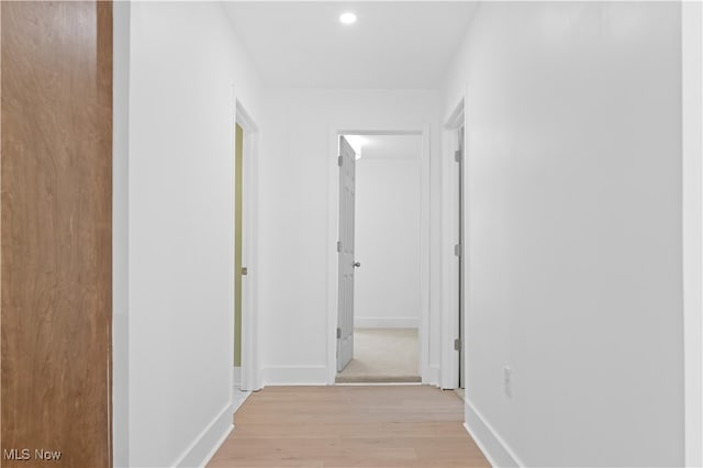 hall with light hardwood / wood-style floors