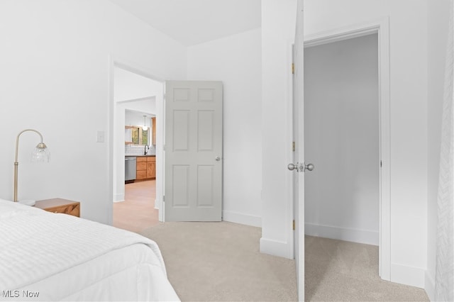 carpeted bedroom with sink