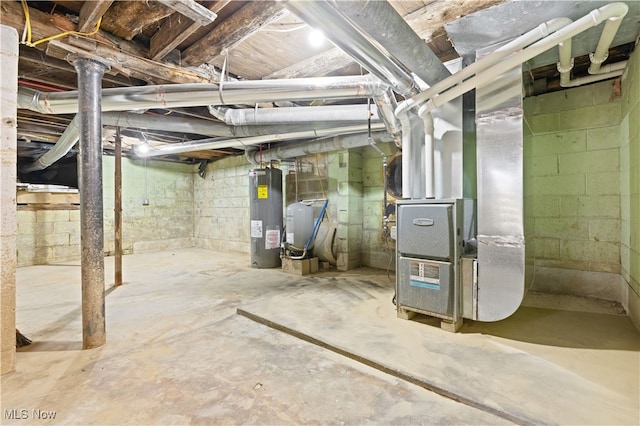 basement featuring water heater and heating unit