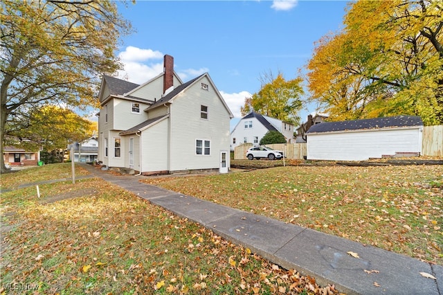 view of side of home featuring a lawn