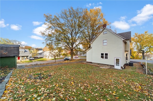 view of home's exterior featuring a lawn and cooling unit