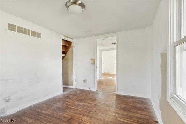 spare room featuring dark hardwood / wood-style floors