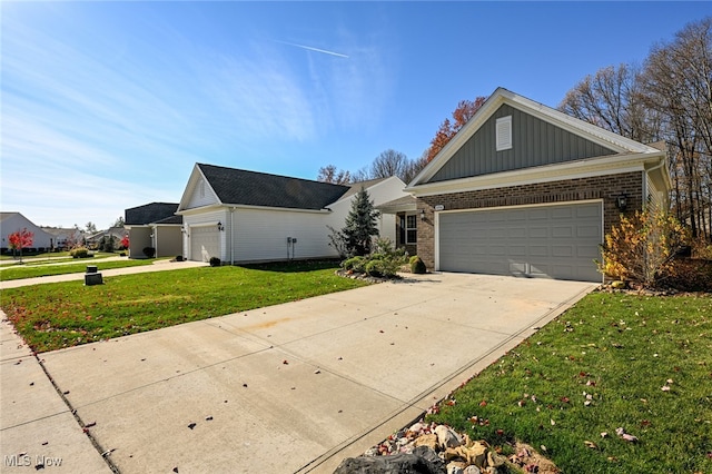 single story home with a garage and a front lawn