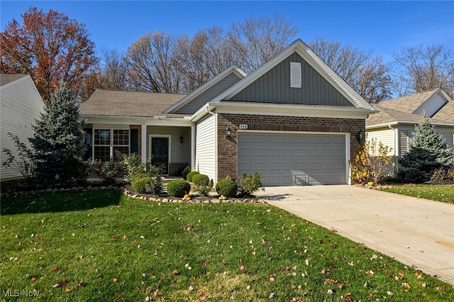 view of front of house with a front yard and a garage