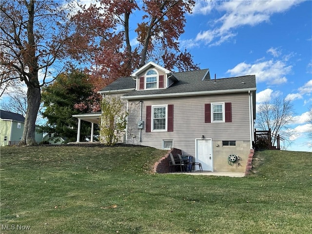 rear view of property with a yard