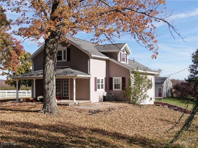 view of side of home featuring central air condition unit