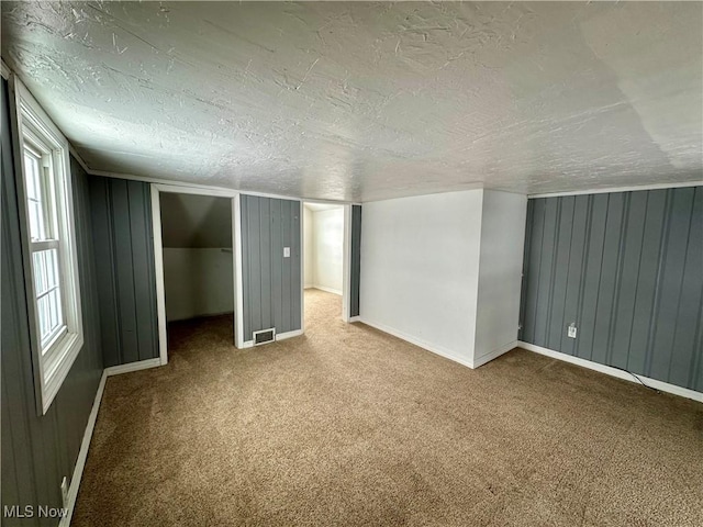 interior space featuring a textured ceiling and plenty of natural light