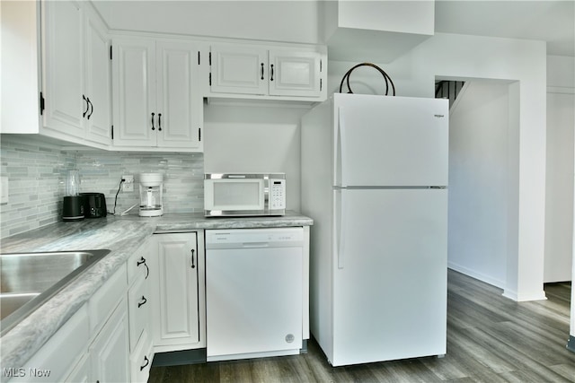 kitchen with white cabinetry, white appliances, backsplash, and dark hardwood / wood-style floors