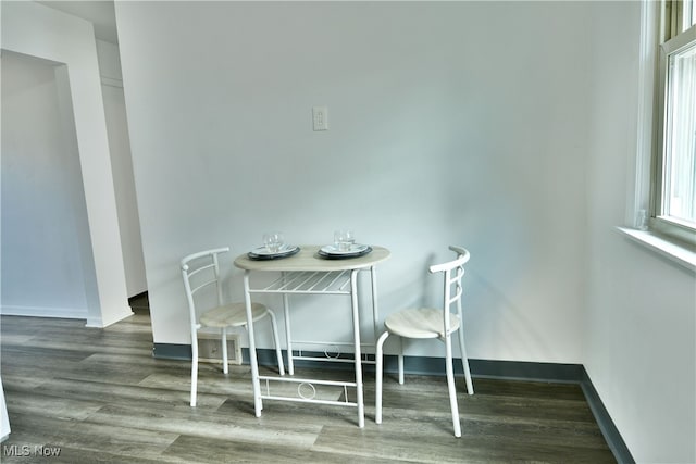 dining room with dark wood-type flooring