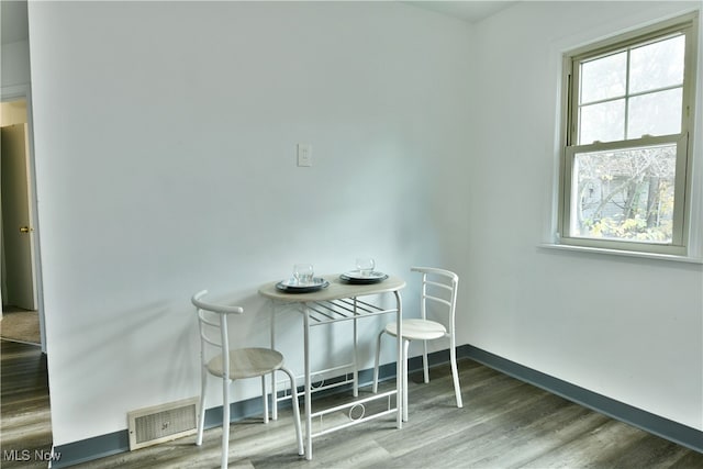 dining area with hardwood / wood-style flooring