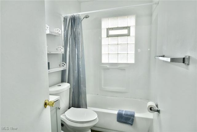 full bathroom with toilet, vanity, and shower / bath combo with shower curtain