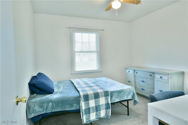 bedroom featuring light carpet and ceiling fan