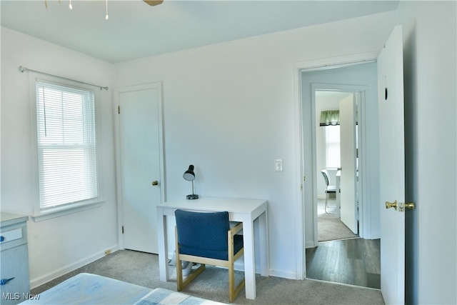 home office with light hardwood / wood-style floors