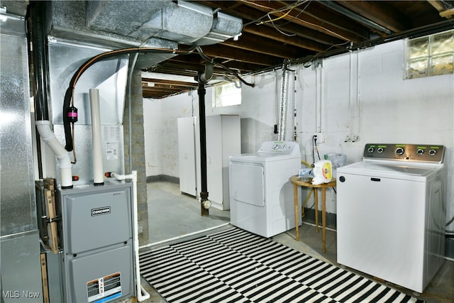 laundry room featuring washing machine and clothes dryer