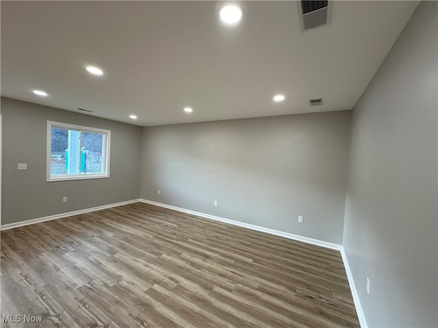 unfurnished room with light hardwood / wood-style floors