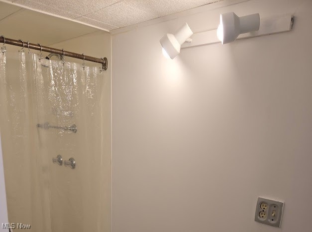 bathroom with a shower with shower curtain