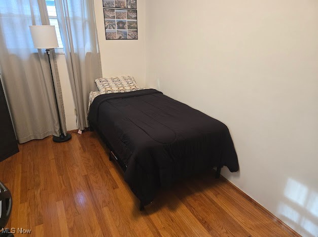 bedroom featuring hardwood / wood-style flooring