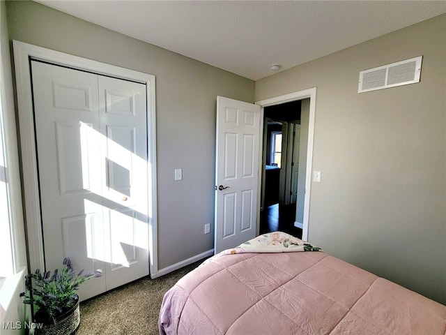 carpeted bedroom with a closet