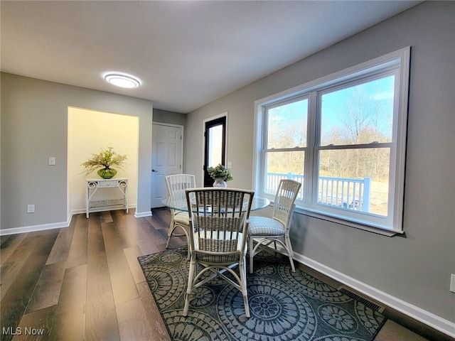 dining room with dark hardwood / wood-style floors