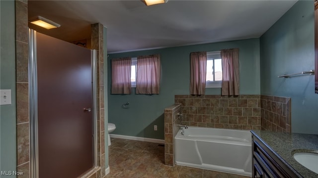 full bathroom with separate shower and tub, vanity, and toilet