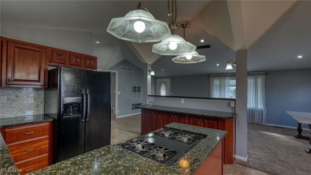 kitchen featuring lofted ceiling, black appliances, light carpet, pendant lighting, and dark stone countertops