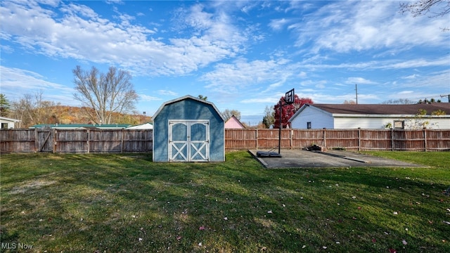 view of yard with a shed and a patio