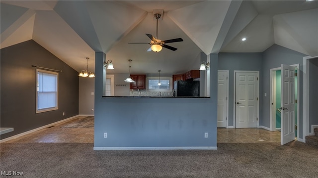 kitchen with ceiling fan with notable chandelier, carpet floors, and black refrigerator