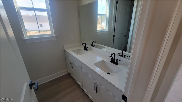 bathroom with wood-type flooring and vanity