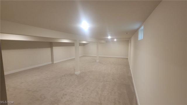 basement with light colored carpet