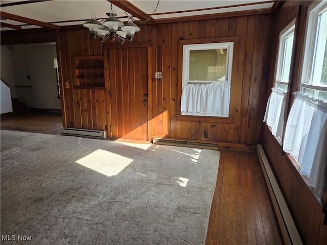 interior space featuring a chandelier, dark hardwood / wood-style floors, and a baseboard heating unit