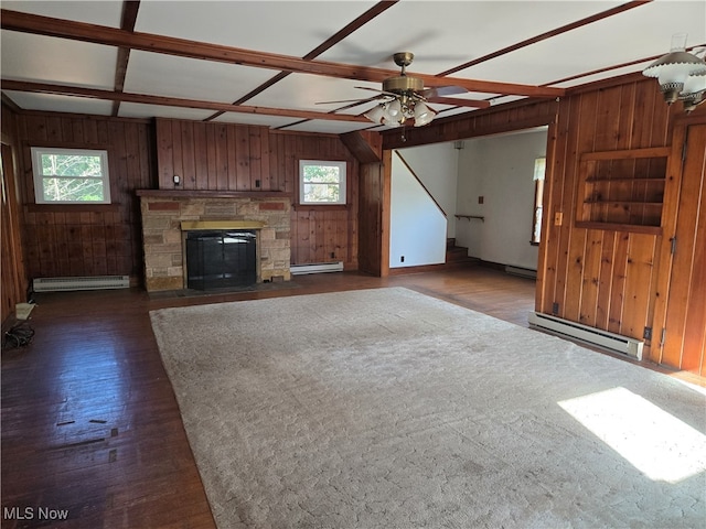 unfurnished living room with plenty of natural light, a baseboard radiator, and dark hardwood / wood-style flooring