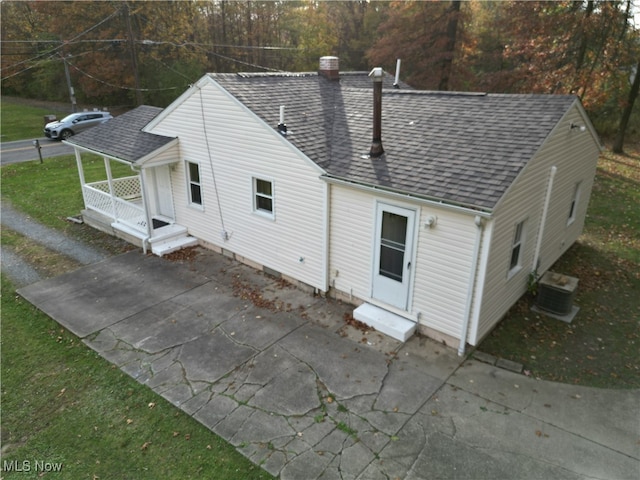 rear view of house with central AC