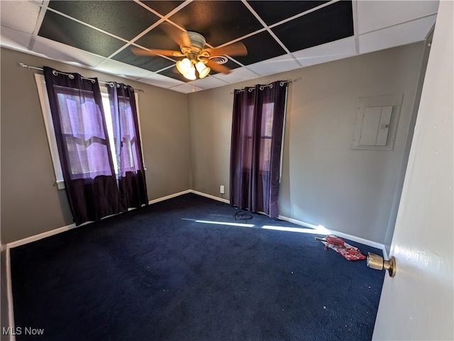 carpeted spare room featuring electric panel and ceiling fan