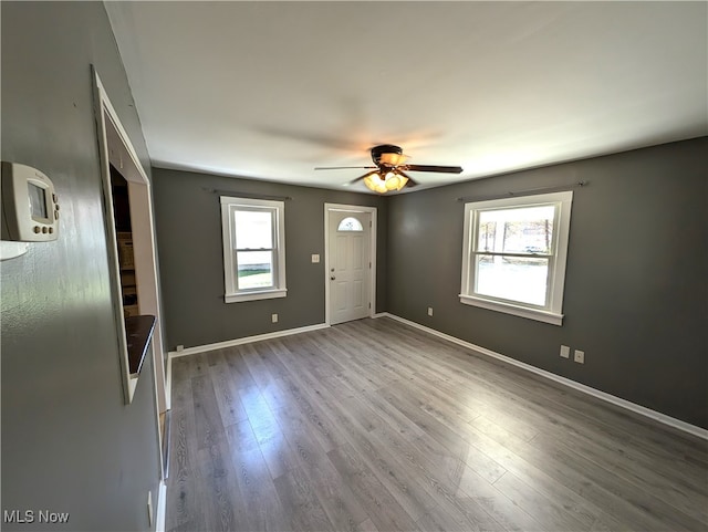 interior space featuring hardwood / wood-style flooring and ceiling fan