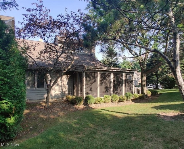 view of home's exterior featuring a lawn