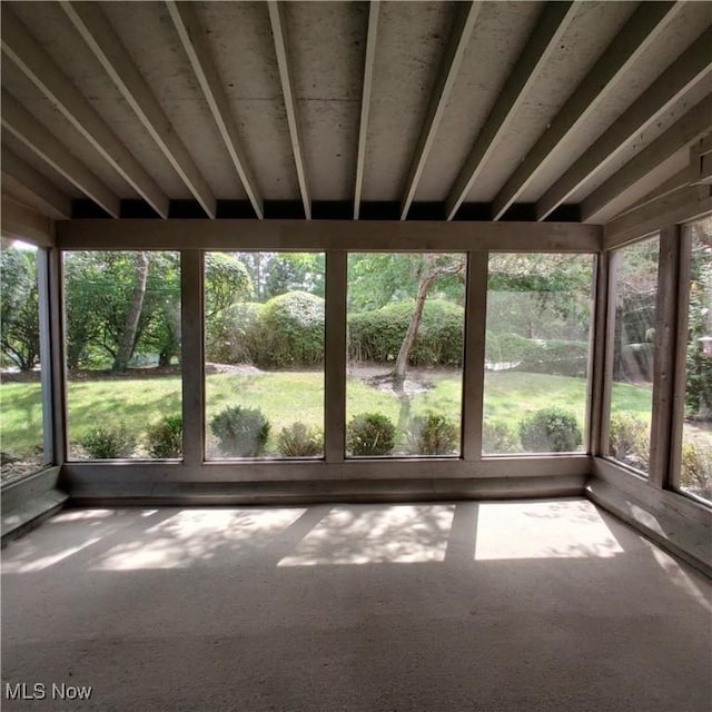 unfurnished sunroom with a wealth of natural light